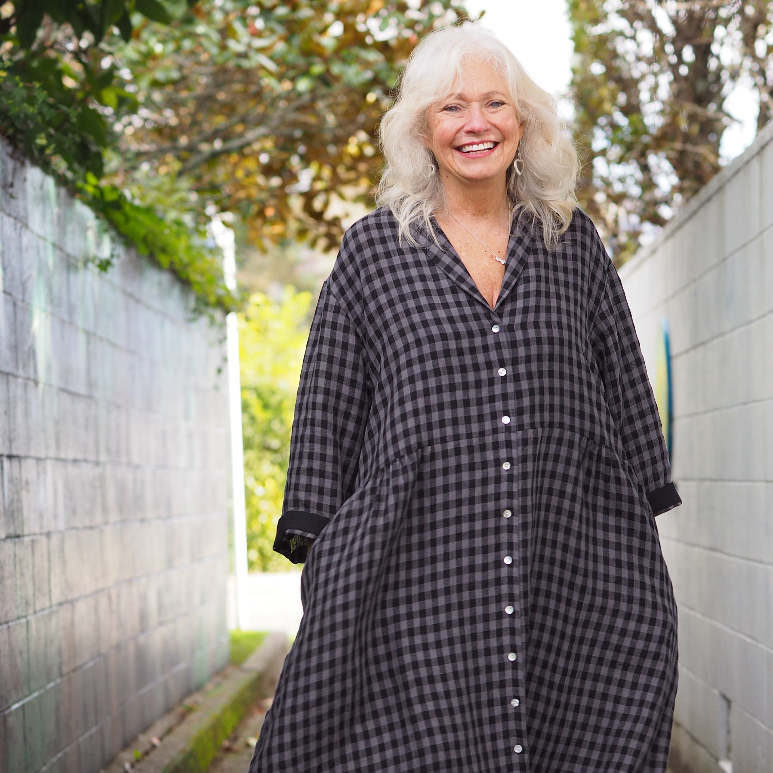 Rogue Linen New Zealand sustainable designer clothing. Photo featuring a grey and black gingham linen dress.