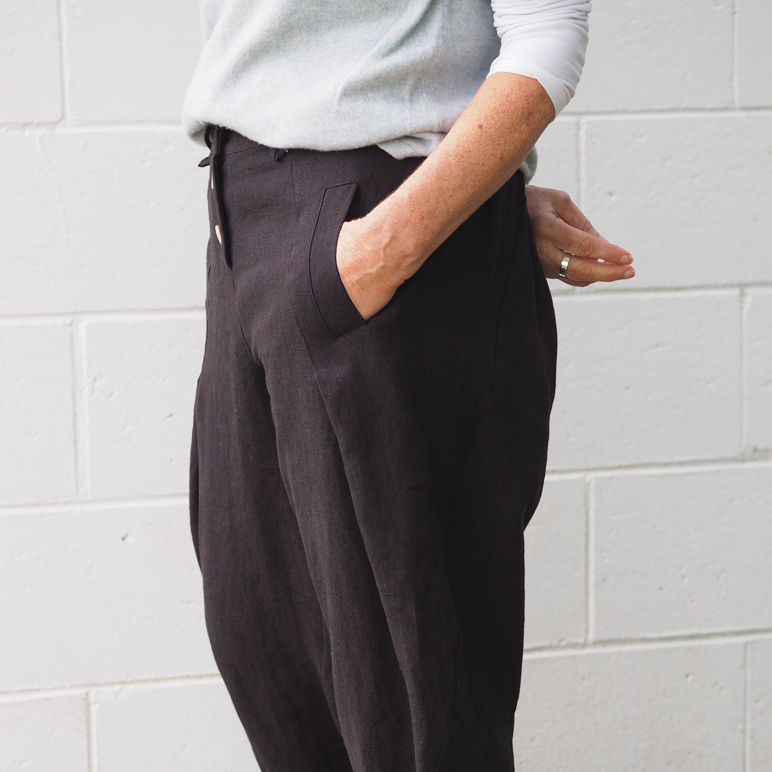 Unique detailed designer linen pants in a black color manufactured by Rogue Linen.