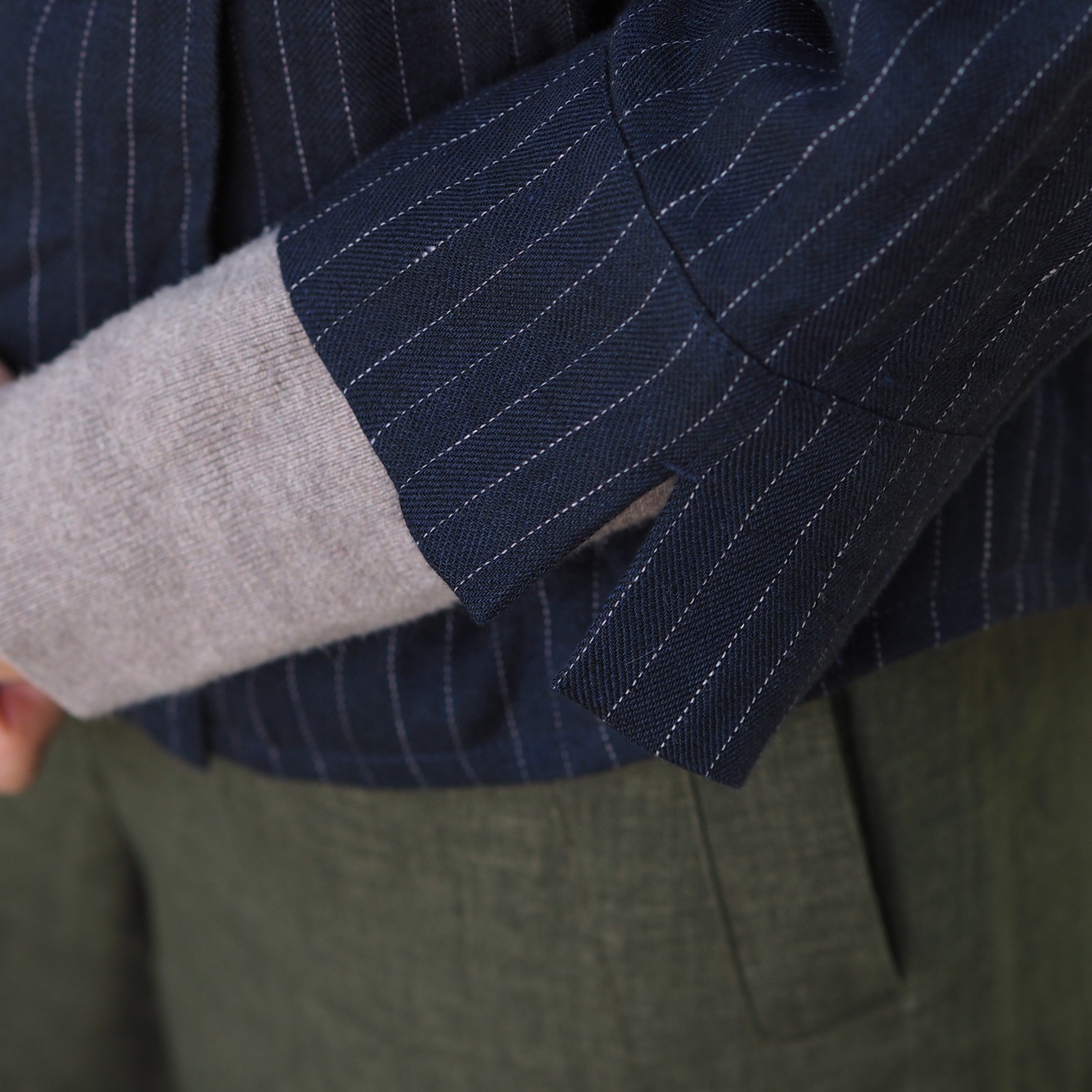 close up of navy herringbone linen on sleeve cuff